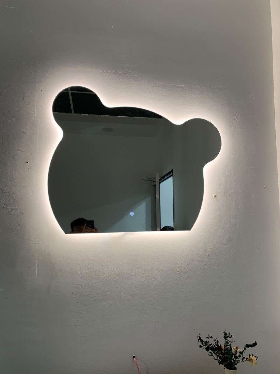 Custom cloud-shaped LED mirror installation